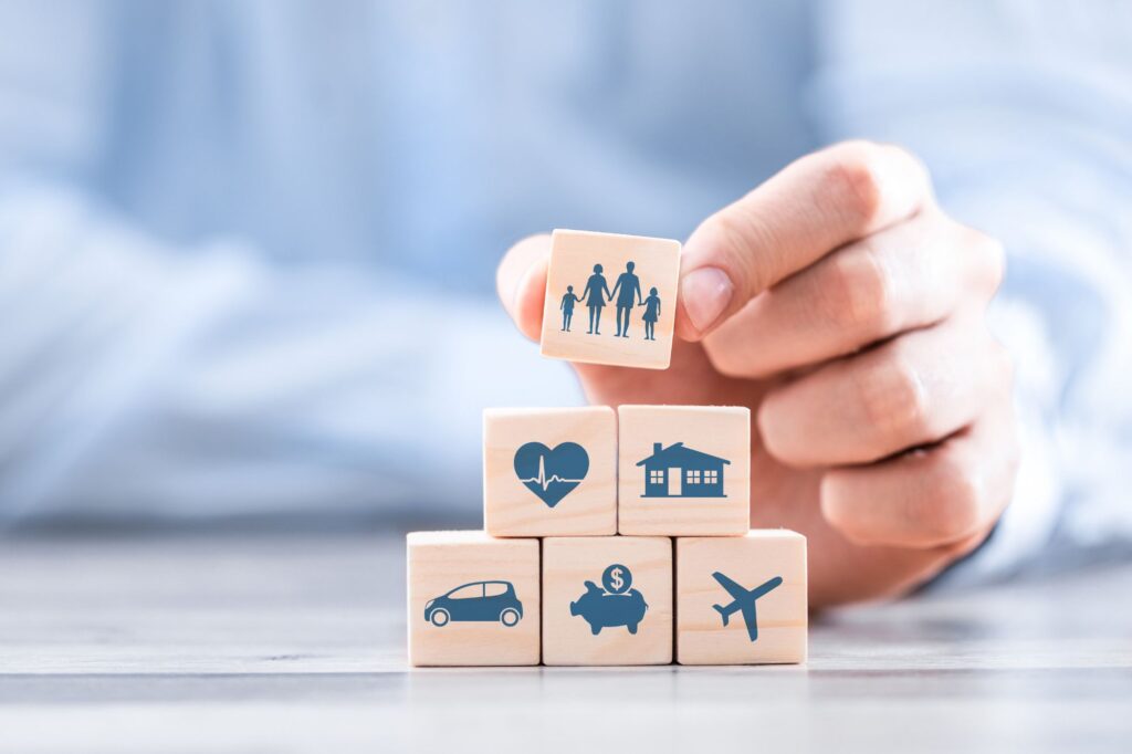 a person is holding wooden blocks with icons on them